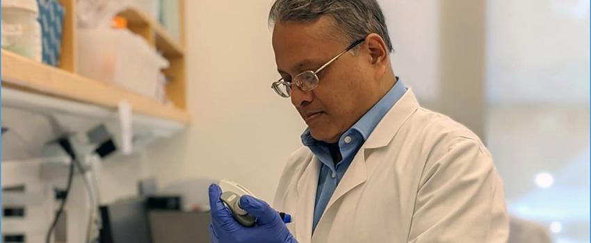 Dr. Dasgupta working in lab.